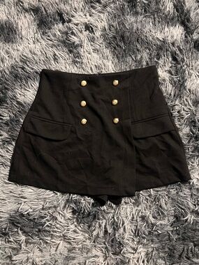 Black mini skort with gold buttons